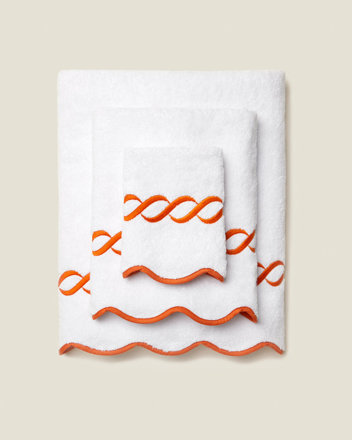 Treccia white/orange bath towel stack